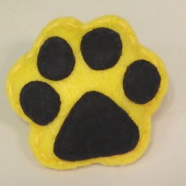 Broche “pegada” amarelo-negro